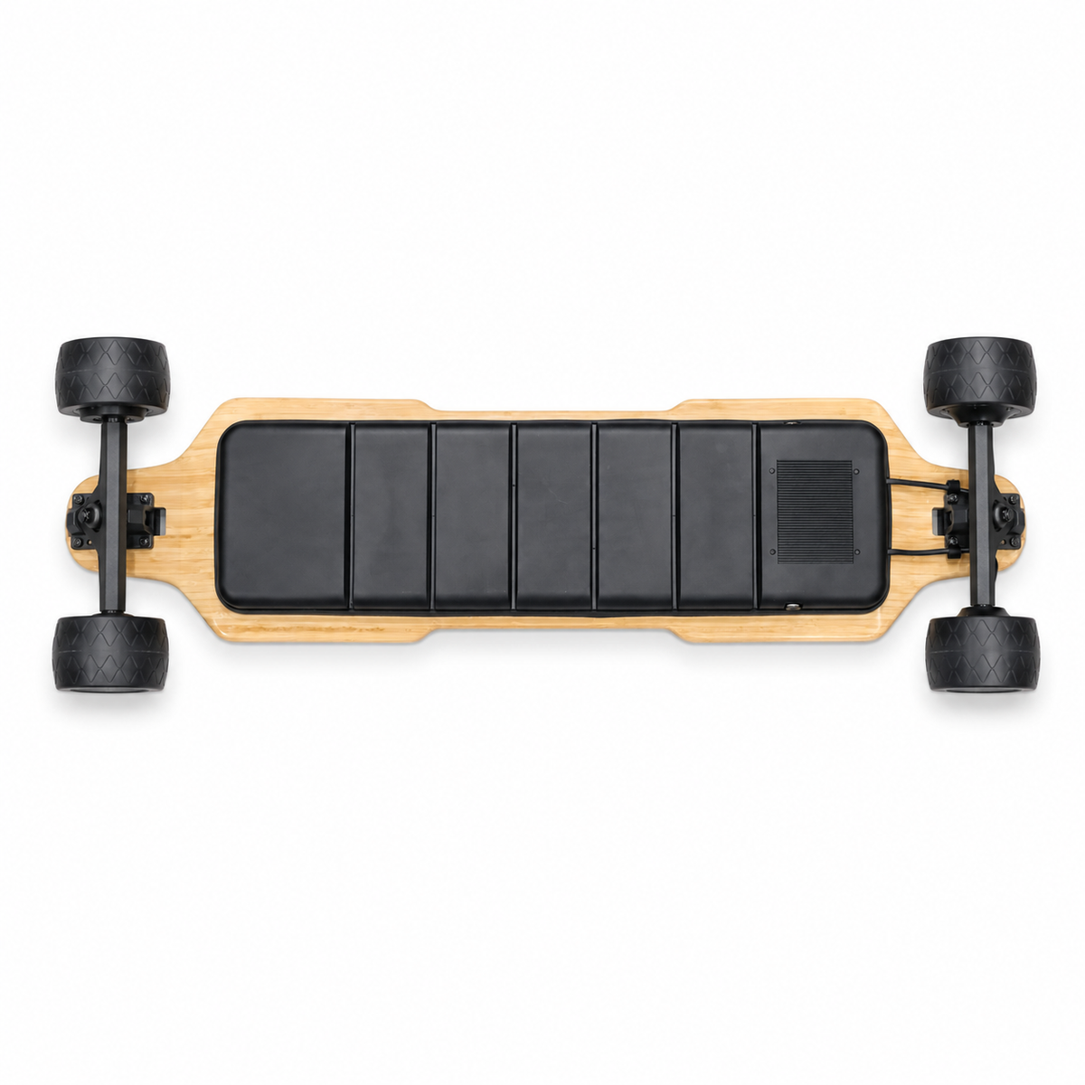 Top-down view of a longboard electric skateboard with a natural wood deck, black traction pads, and black wheels on a white background. Journ-E Sapartan